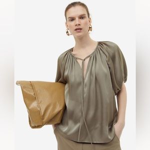A H&M blouse with tie detail. Light fabric, silk. Medium, like new